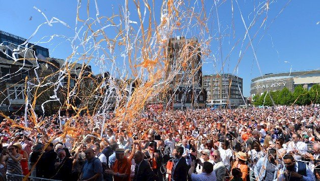 Orange and white streamers fill the air