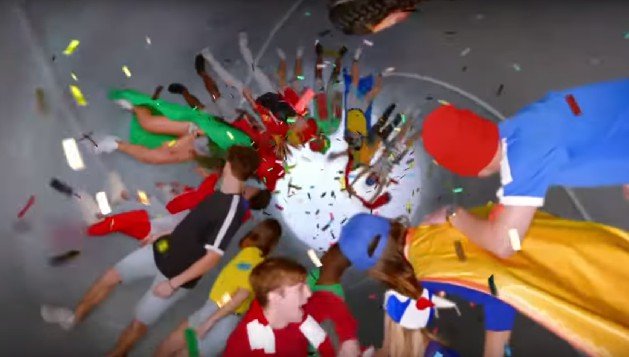 Multicolour confetti surrounds football fans